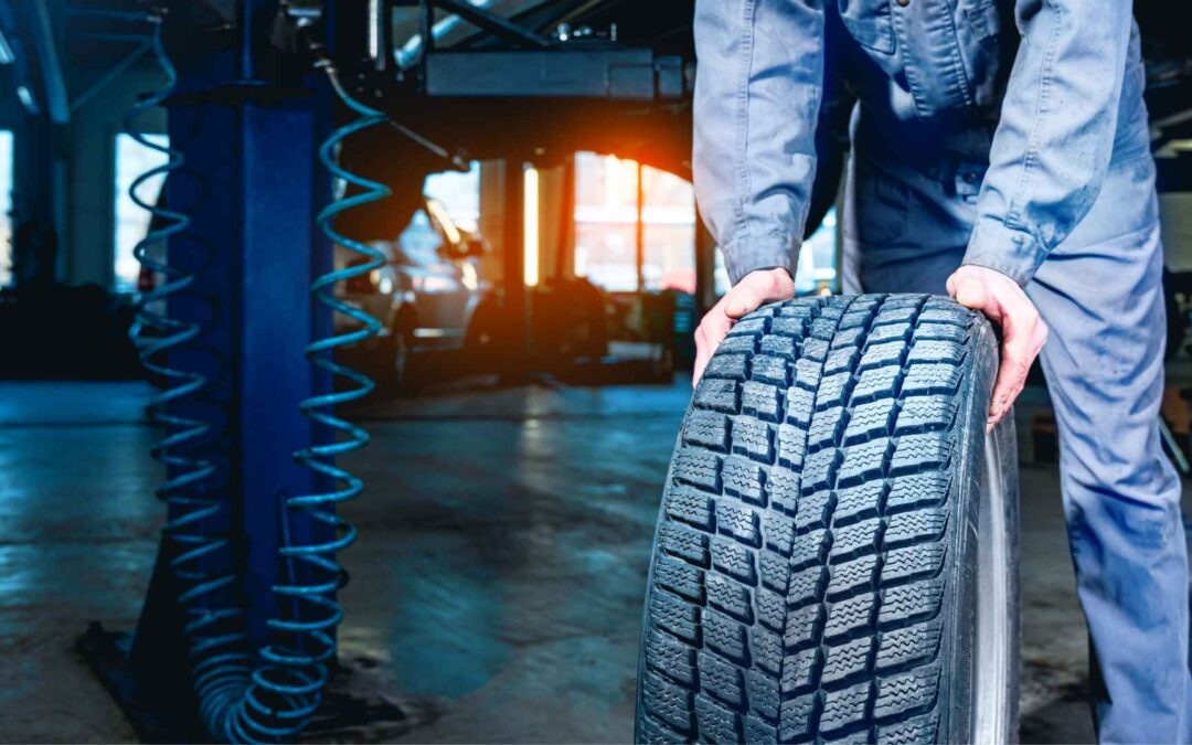 mechanic swapping tires in a shop