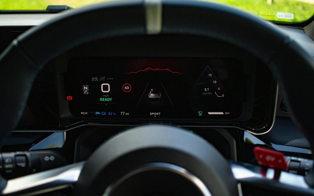 Car steering wheel and modern dashboard with lights coming on to indicate warnings and signs